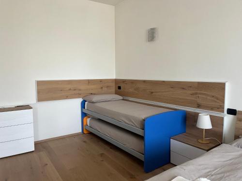 a small bedroom with a bed and a desk at Interno 12 Sweet Home in Verona