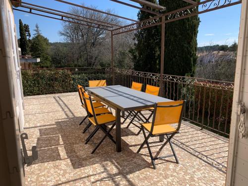 a table and chairs sitting on a patio at la grande villa in Aix-en-Provence