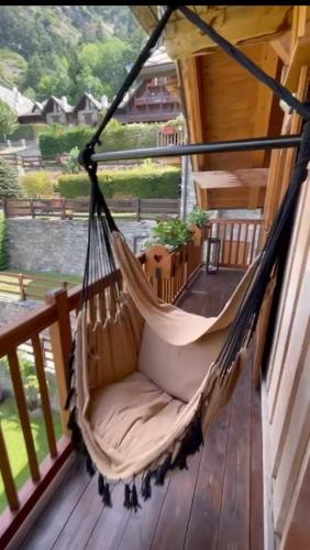 a hammock on a porch with a view at L'Ame du Mont Blanc in Pré-Saint-Didier
