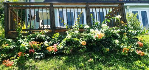 a garden of flowers in front of a gazebo at Memwa Villas in Castries
