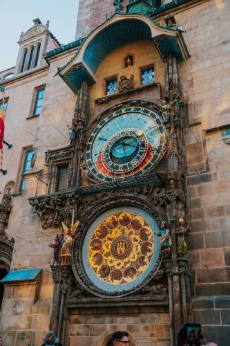 a clock on the side of a building at Hotel Karlin in Prague