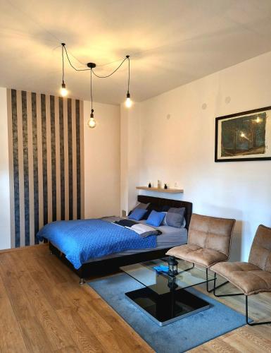a bedroom with a bed and a couch at Apartments Sandra in Lovran