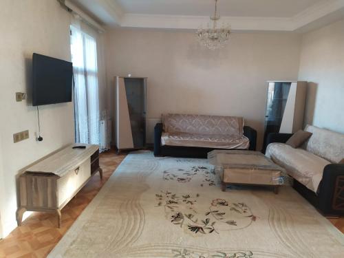 a living room with a couch and a table at Villa in Nakhchivan city, Azerbaijan in Naxçıvan