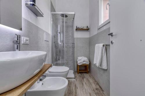 a bathroom with a sink and a toilet and a shower at Villa Govi-Pancaldi in San Lazzaro di Savena
