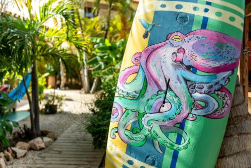 a surfboard with an elephant painted on it at Casa Calexico in Kralendijk
