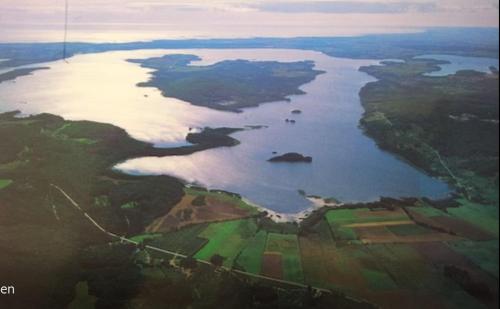 an aerial view of a large body of water at Ferienhaus Kronenpark, Angelcamp mit Angelboot, Kanus, Fahrräder, Jakuzzi, uvm. in Bromölla