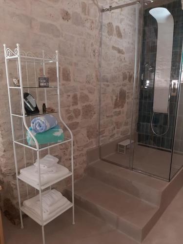 a bathroom with a shower and a rack with towels at Filioli 28 in Bari