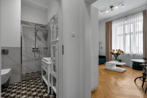 a bathroom with a walk in shower and a sink at Luxury Apartment next to Koszykowa Street in Warsaw