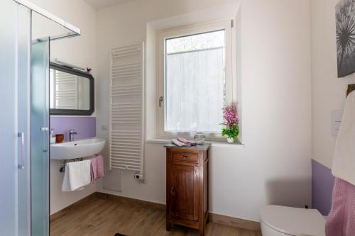a bathroom with a sink and a window at B&B Agriturismo La Casetta di Ben in Viterbo