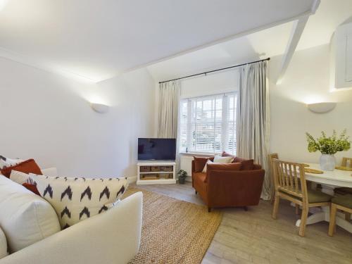 a living room with a couch and a table at “The Sleepers Cottage” 2-6 people w/ free parking in Hough Green