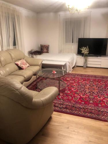 a living room with a couch and a coffee table at bnb mary in Björnlunda