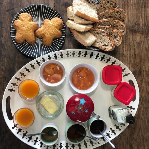 a plate of food with bread and other foods at Le 270 in Grane