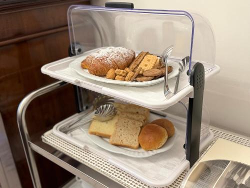 a plate of bread and cookies in a refrigerator at 301B&B in Palermo