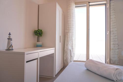 Katil atau katil-katil dalam bilik di Attico Terrazza CieloMare Seaview