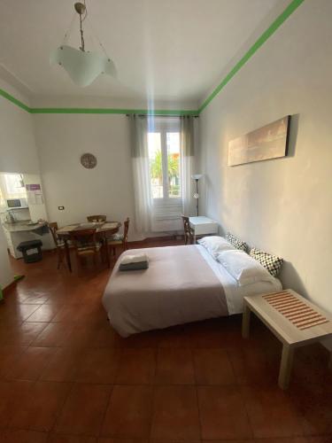 a bedroom with a bed and a table in it at Morgagnigd in Florence