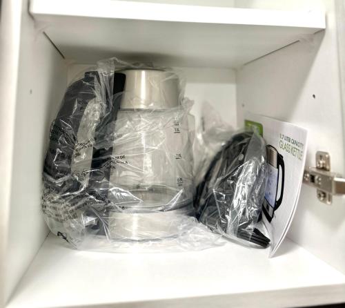 a tea kettle is inside of a refrigerator at Entire Home In Niagara Falls, Canada in Niagara Falls