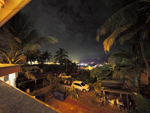 a car parked in a parking lot at night at La Pescador Home Stay, Baga in Baga