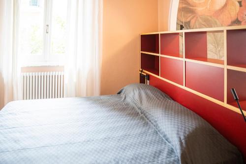 a bedroom with a bed and a large window at 051 - Villa Genny Appartamento Agrumi in Sestri Levante