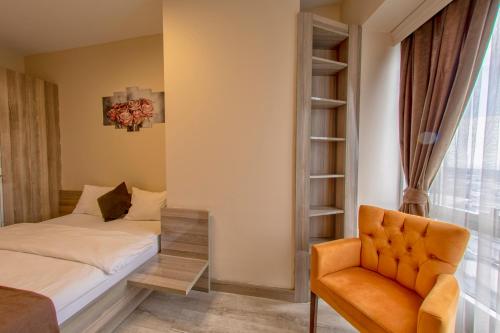 Postel nebo postele na pokoji v ubytování My House N5 Suites Hotel