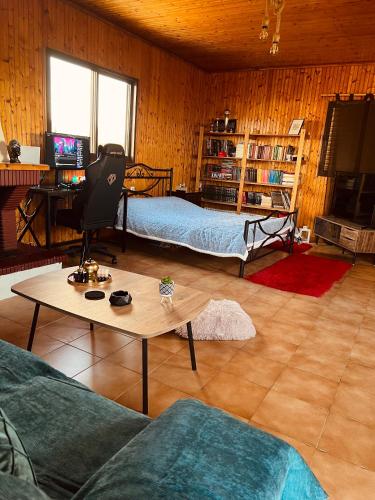 a living room with two beds and a coffee table at Attic House in Patra