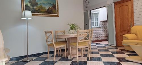a dining room with a table and chairs at piso en arenas de velez malaga in Málaga