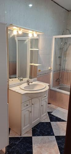 a bathroom with a sink and a shower and a tub at piso en arenas de velez malaga in Málaga