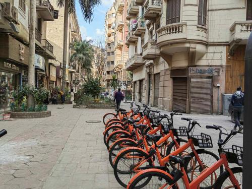 a row of bikes parked on a city street at City View Palace hotel in Cairo