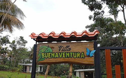 a sign for a zoo with a sign for a building at Villa Buenaventura in San Ramón