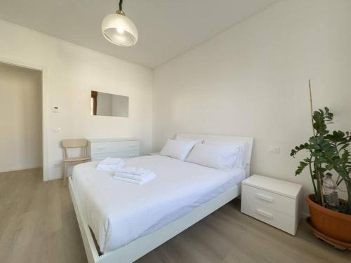 Ein Bett oder Betten in einem Zimmer der Unterkunft Ocean-Group Apartment Ipazia