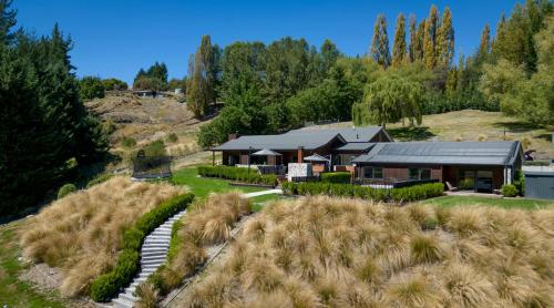 an aerial view of a house on a hill at Queenstown Snowland Estate in Queenstown