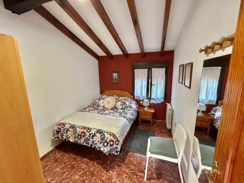 a bedroom with a bed in a room at La Cabaña de Agustin in Ortiguero