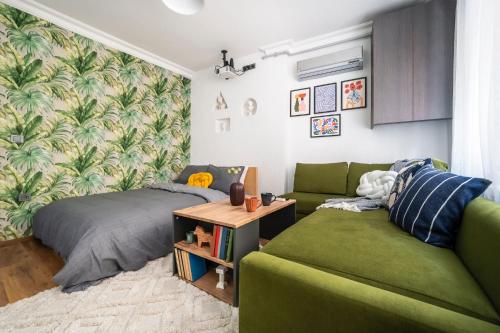 a living room with a couch and a bed at GALATA FİVE APARTMENTS in Istanbul