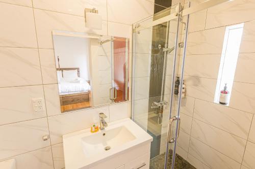 a bathroom with a sink and a shower at Feels like your home ! in Auckland