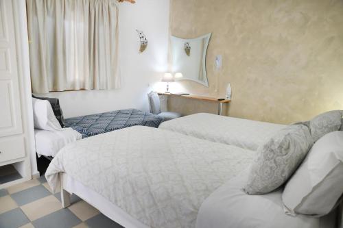Ένα ή περισσότερα κρεβάτια σε δωμάτιο στο Panorama Studios & Apartments