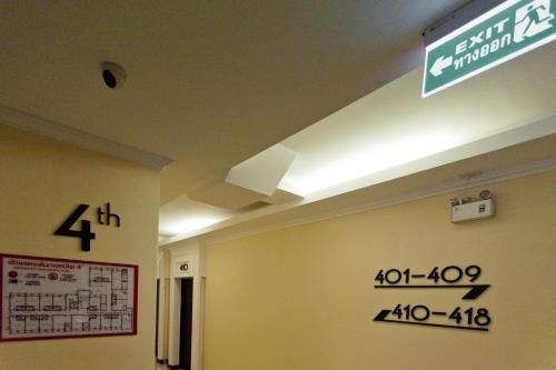 a hospital room with a sign on the ceiling at The Proud Hotel in Ubon Ratchathani