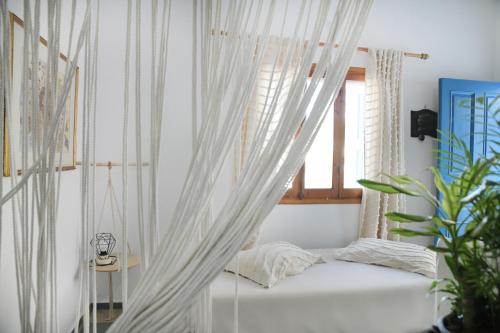 Ένα ή περισσότερα κρεβάτια σε δωμάτιο στο Panorama Studios & Apartments