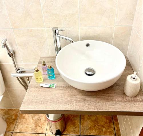a white sink sitting on a counter in a bathroom at Casa Vacanze La Baia in Messina