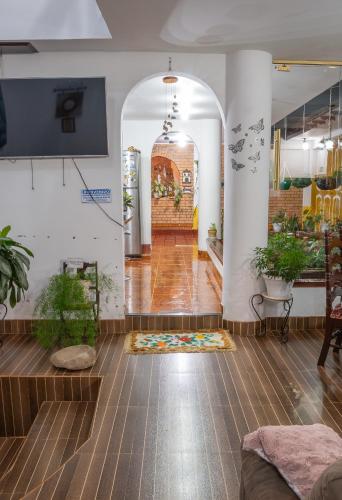 an open hallway with an archway in a building at HOTEL LA CASONA SAN AGUSTIn in San Agustín