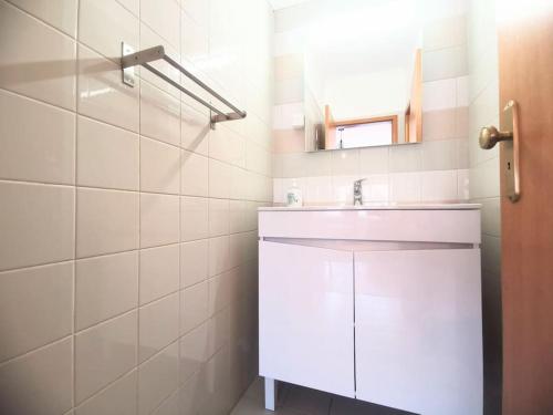 a white bathroom with a sink and a mirror at new sunny house! your home Lisbon apartment in Lisbon