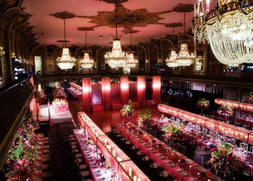 an image of a banquet hall with tables and chandeliers at Hilton Chicago in Chicago