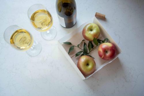a plate of apples and two glasses of wine at Hilton Chicago in Chicago