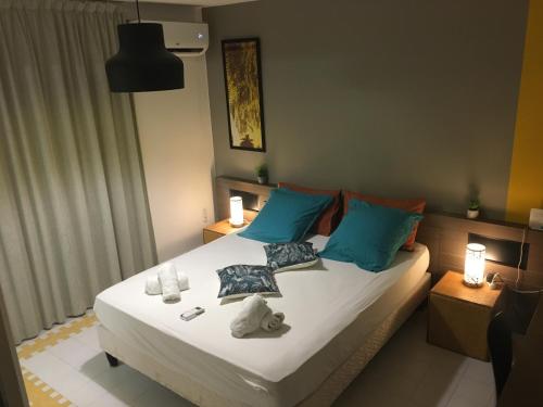 a bedroom with a bed with towels on it at Good Mood Studio - Manganao in Saint-François