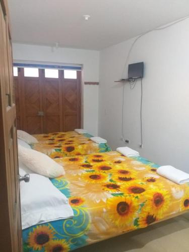 Postel nebo postele na pokoji v ubytování Hospedaje el Jazmin