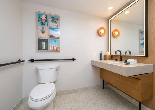 a bathroom with a toilet and a sink at Hilton San Diego Gaslamp Quarter in San Diego