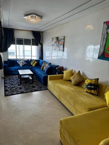 a living room with a couch and a table at Yanis guest house in Casablanca