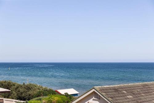 a view of the ocean from a house at Beach Retreat Apartment A in Frankston