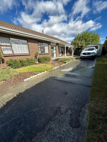 a car parked in the driveway of a house at Omara-more in Omarama