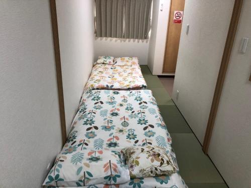Gulta vai gultas numurā naktsmītnē Nishikujo stay3 - Vacation STAY 9213