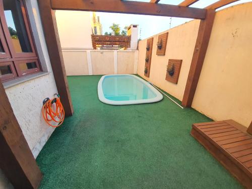 a room with a pool on the floor of a house at Casa-Ampla Porto Alegre-RS in Porto Alegre