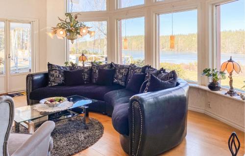 a living room with a couch and a table at Beautiful Home In Sderkping With Wifi in Söderköping